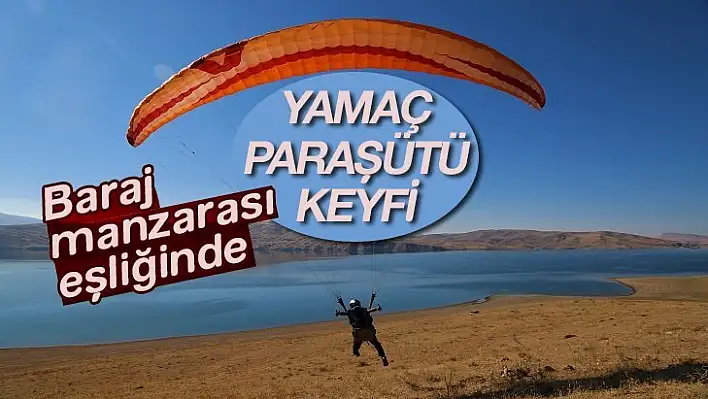 Baraj manzarası eşliğinde yamaç paraşütü keyfi